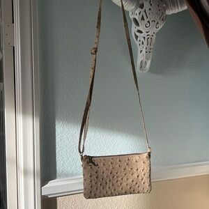 Only used once for a night tan leather bag